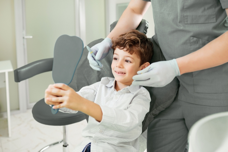 A child after a pediatric dentistry appointment at staley dental arts