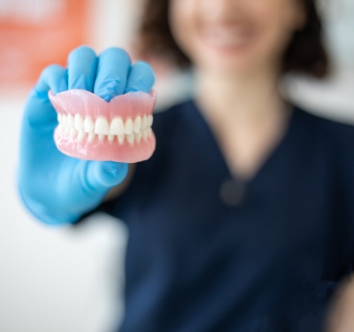 model depicting upper and lower dentures & partials in kansas city dental clinic