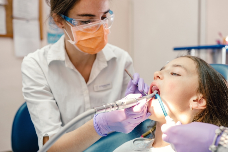 Dentist greeting a same day dentist near me patient at Staley Dental Arts in Kansas City.