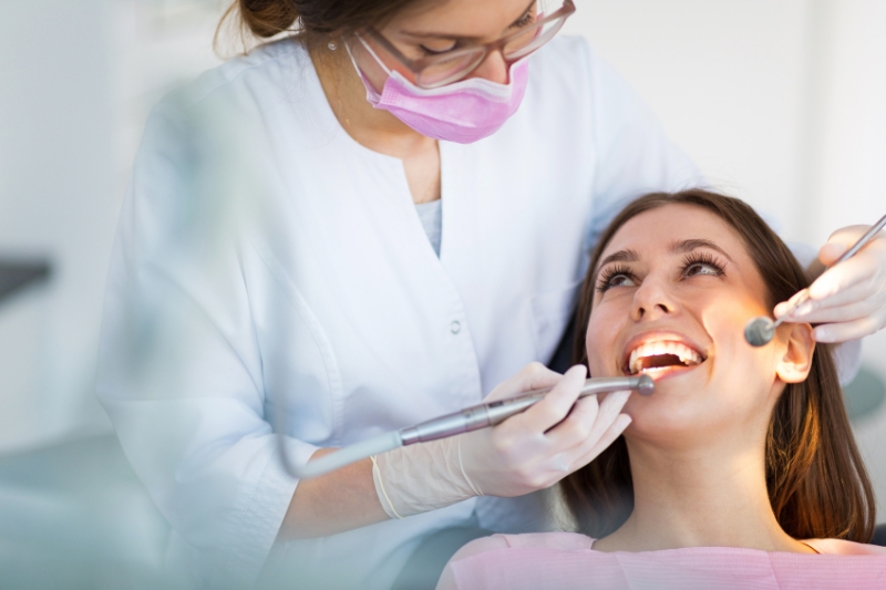 Walk in dental near me in in Kansas City seeing a female patient.